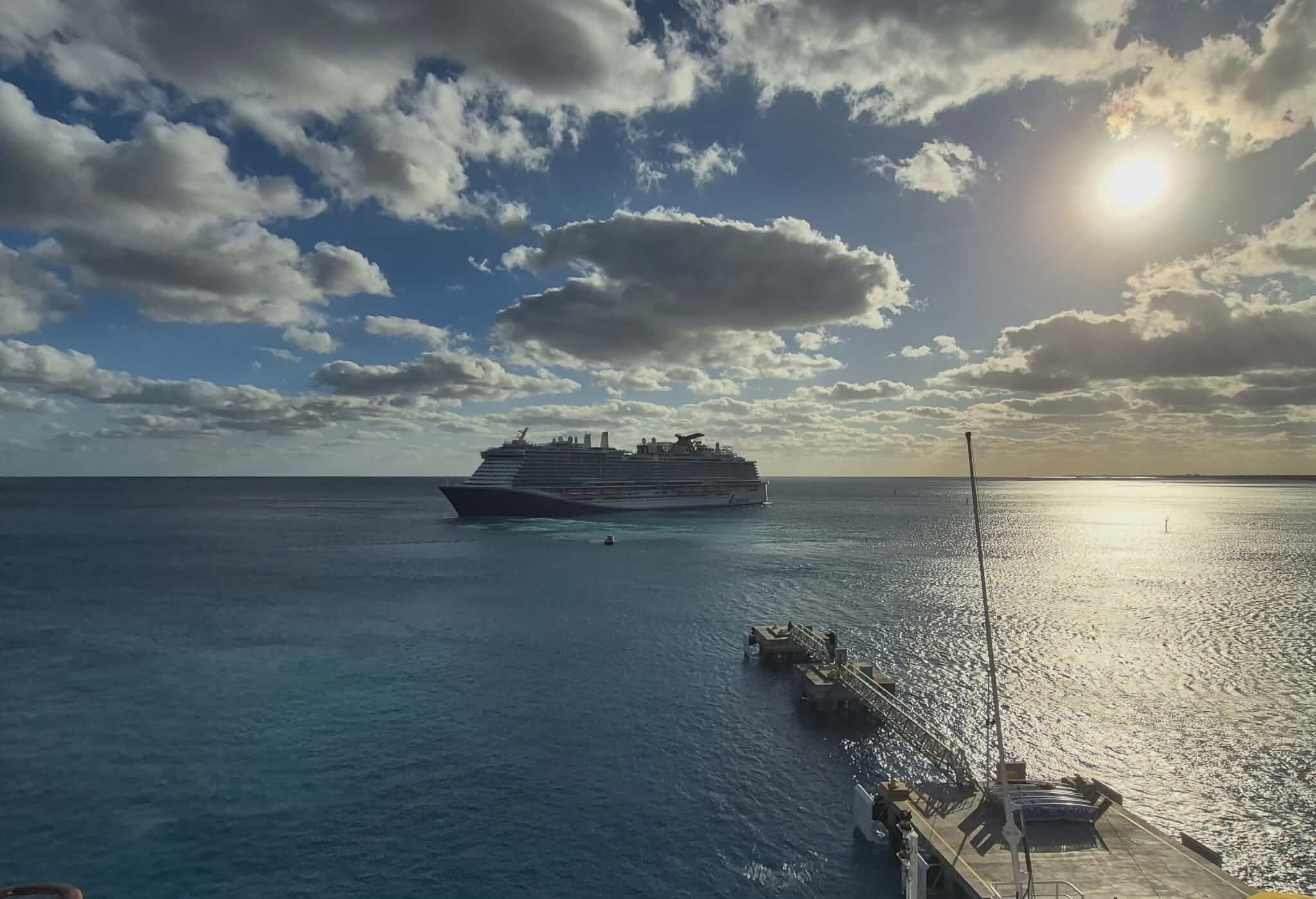 Carnival Celebration approaching the cruise pier at sunrise